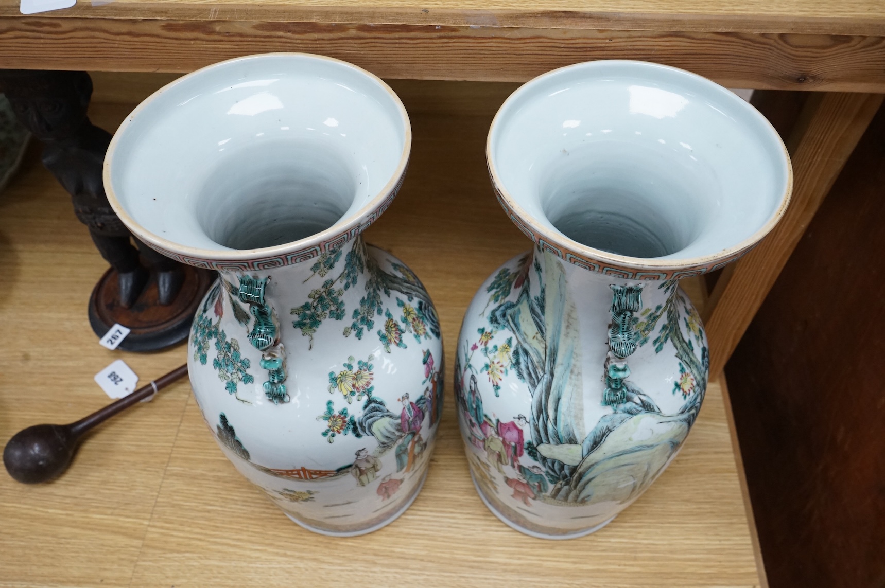 A pair of large late 19th century Chinese famille rose ‘scholars’ vases, 45cm high